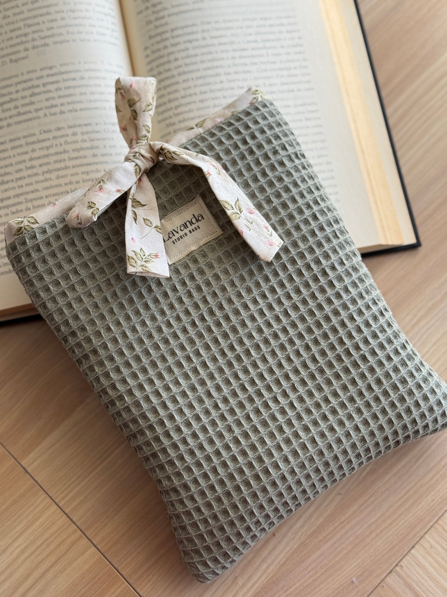 Book cover green waffle and floral pattern. With ribbon.