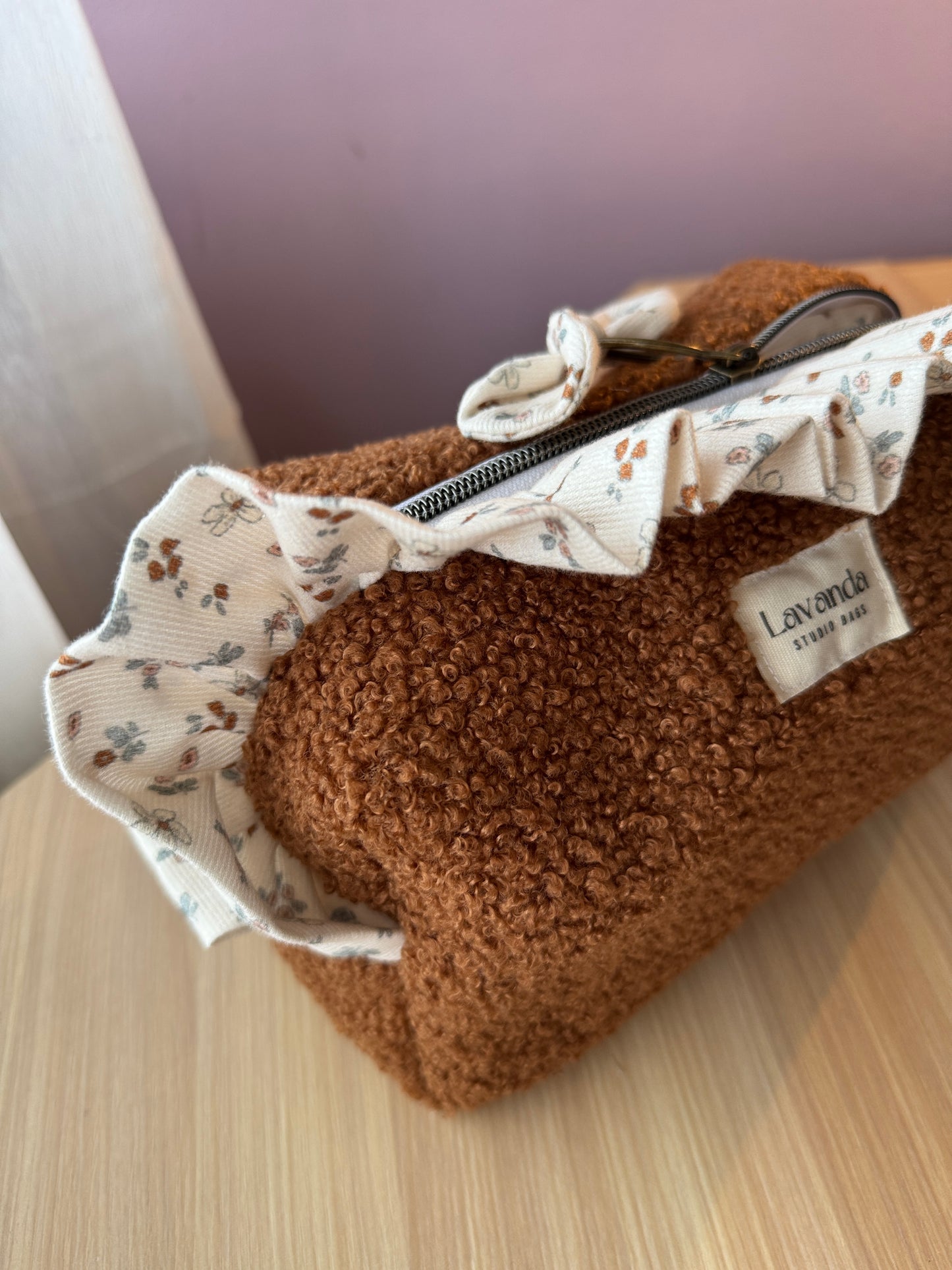 Fresia teddy cosmetic bag brawn with ruffle.