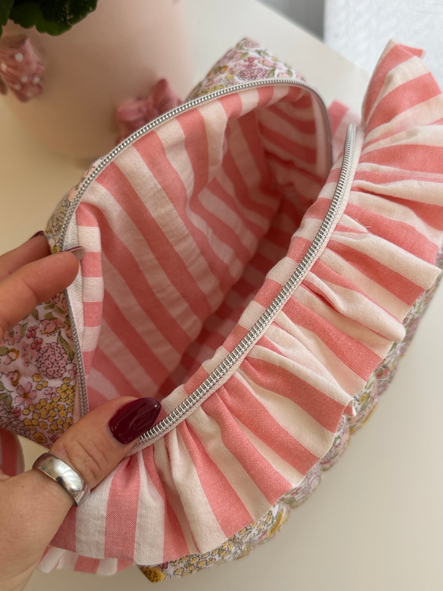 Fresia cosmetic bag flowers with ruffle.