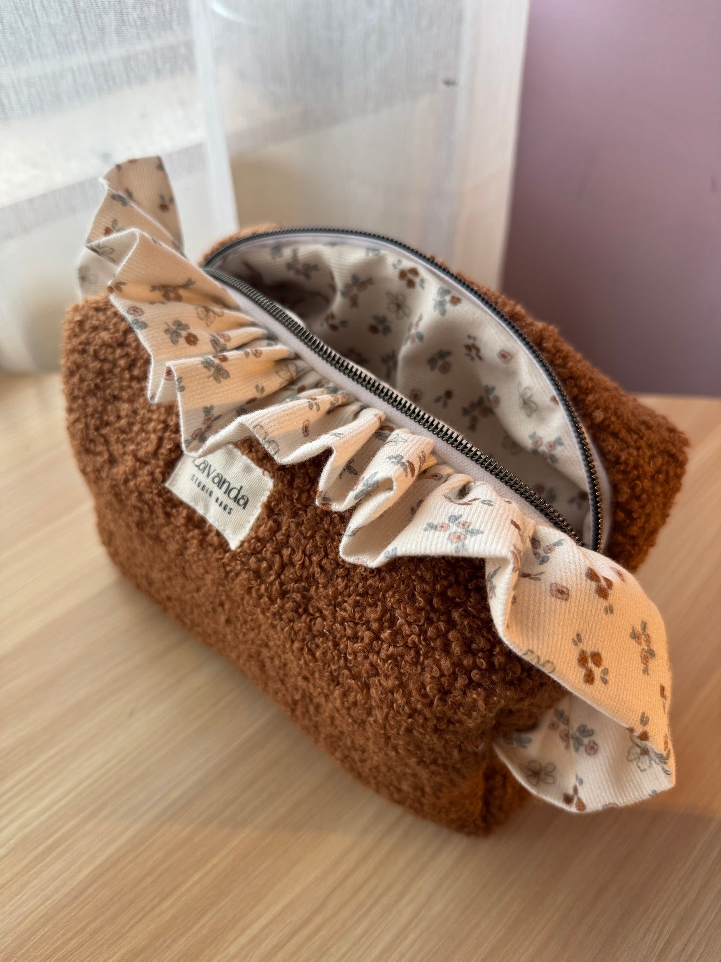 Fresia teddy cosmetic bag brawn with ruffle.