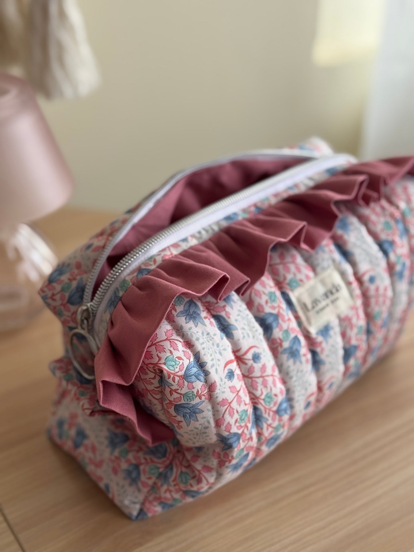 Cosmetic bag blue breeze and pink colour.