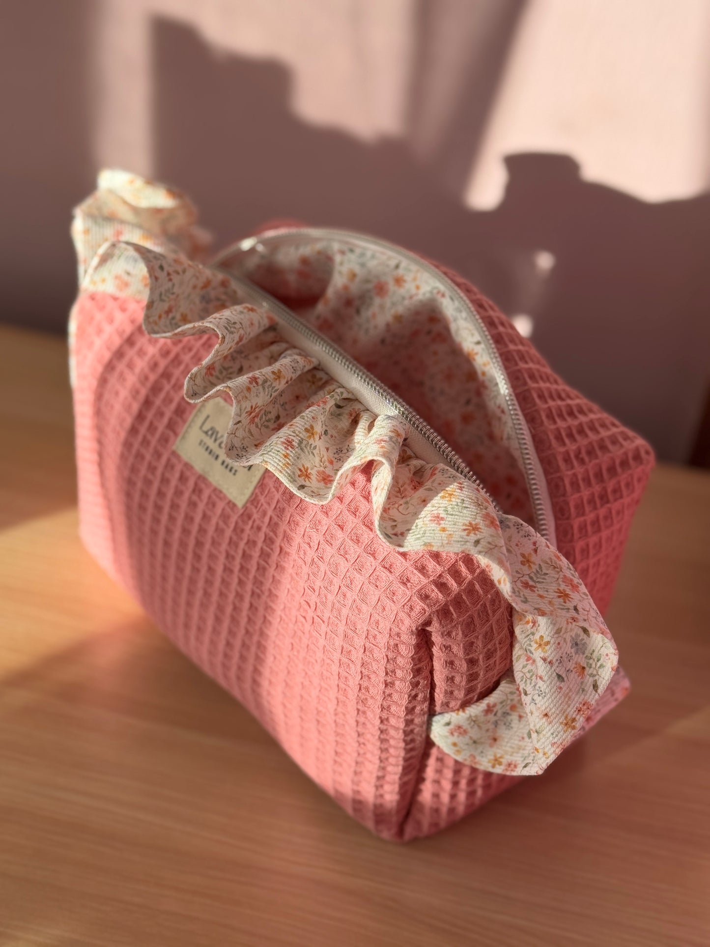 a.Cosmetic bag fresia pink light waffle and mini flowers.