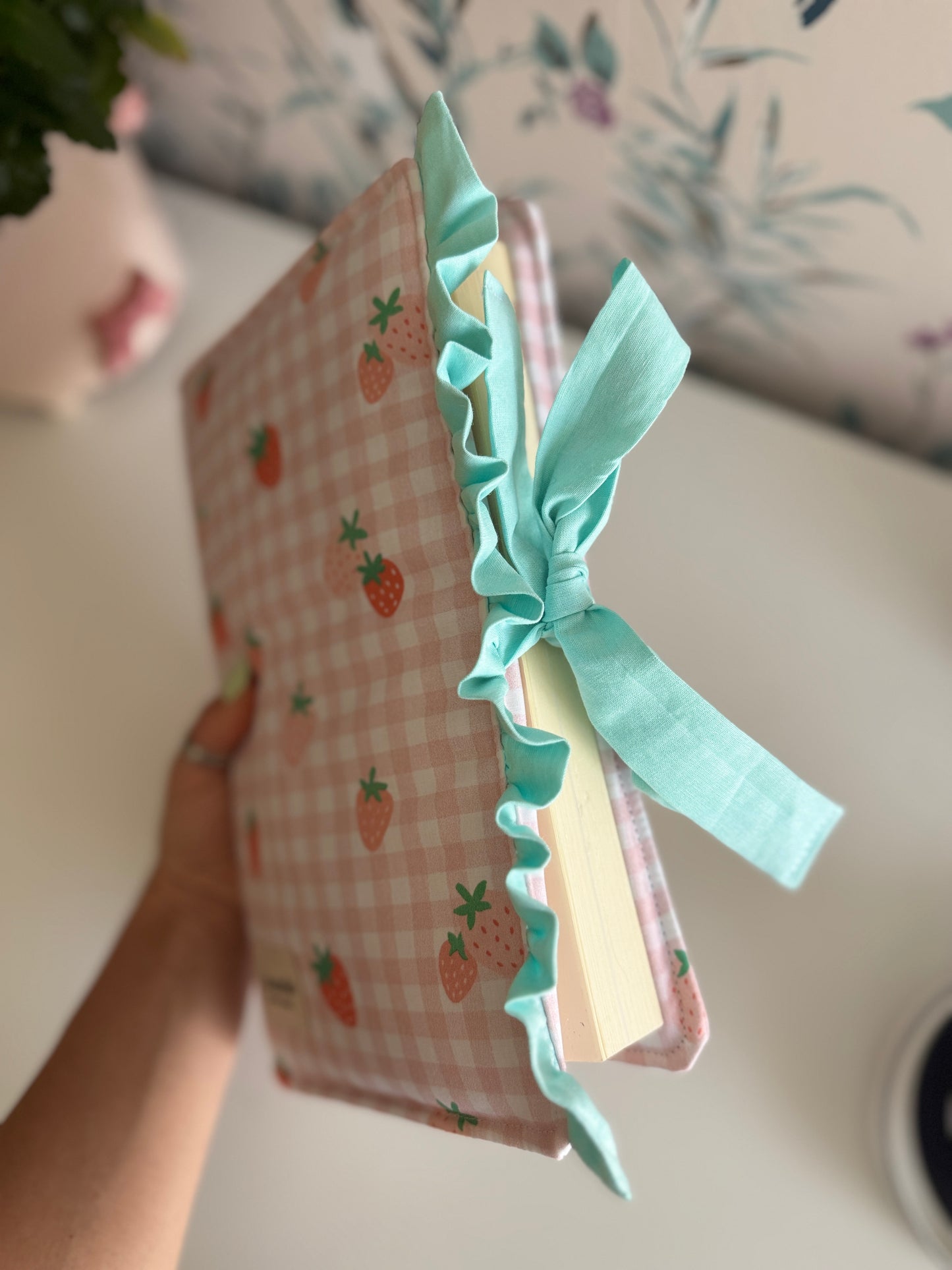 Book cover with flaps strawberry and green colour.
