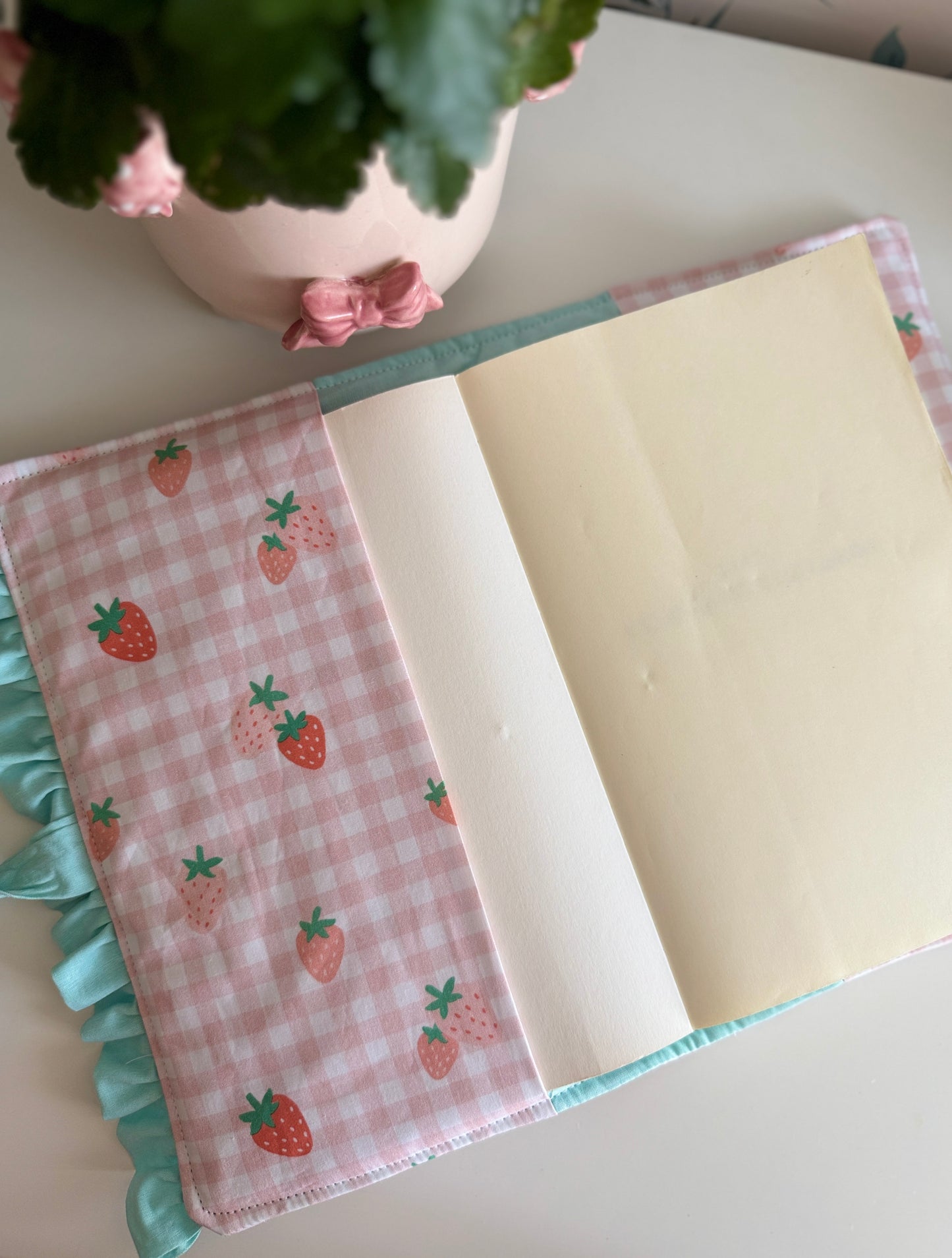 Book cover with flaps strawberry and green colour.
