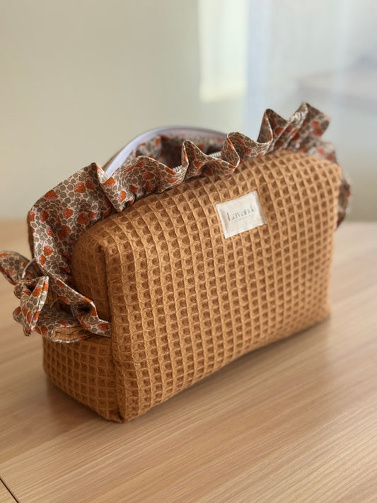 a.Cosmetic bag fresia orange flowers.