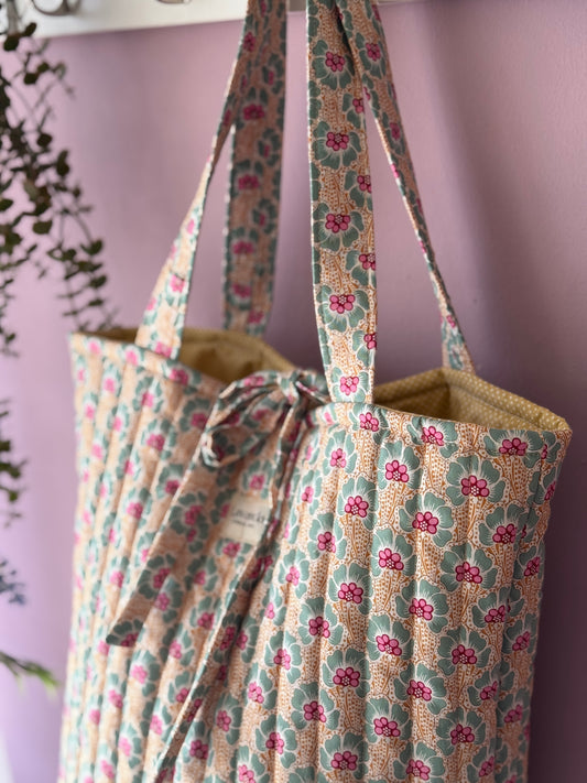 Bolso de mano Adina miel floral.