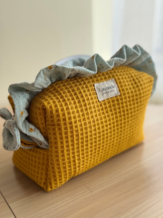 a.Cosmetic bag fresia yellow waffle and mini flowers.