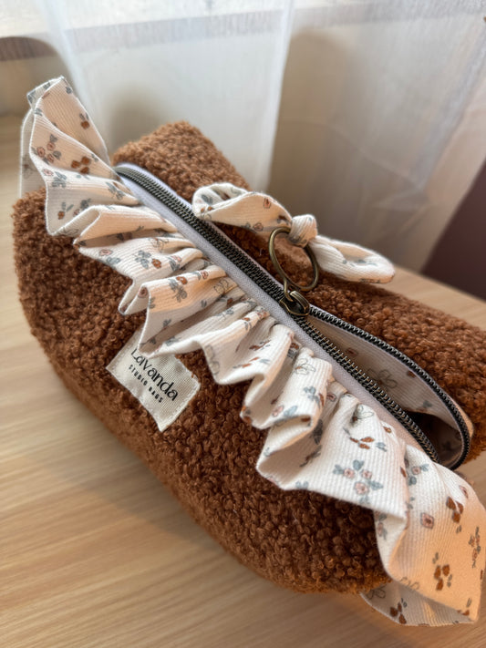 Fresia teddy cosmetic bag brawn with ruffle.