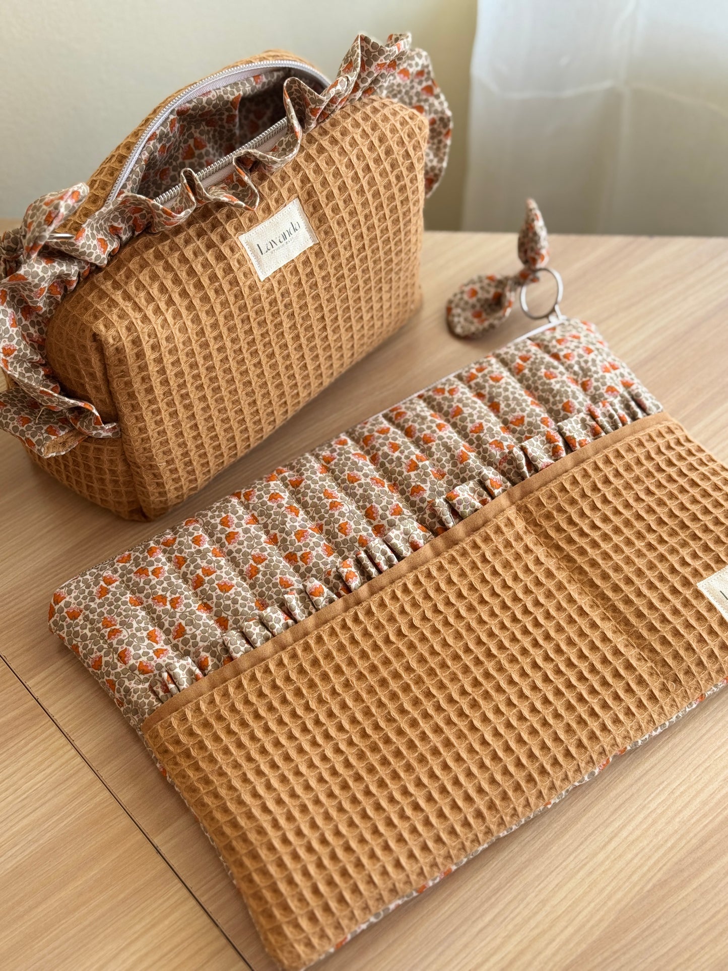 a.Cosmetic bag fresia orange flowers.