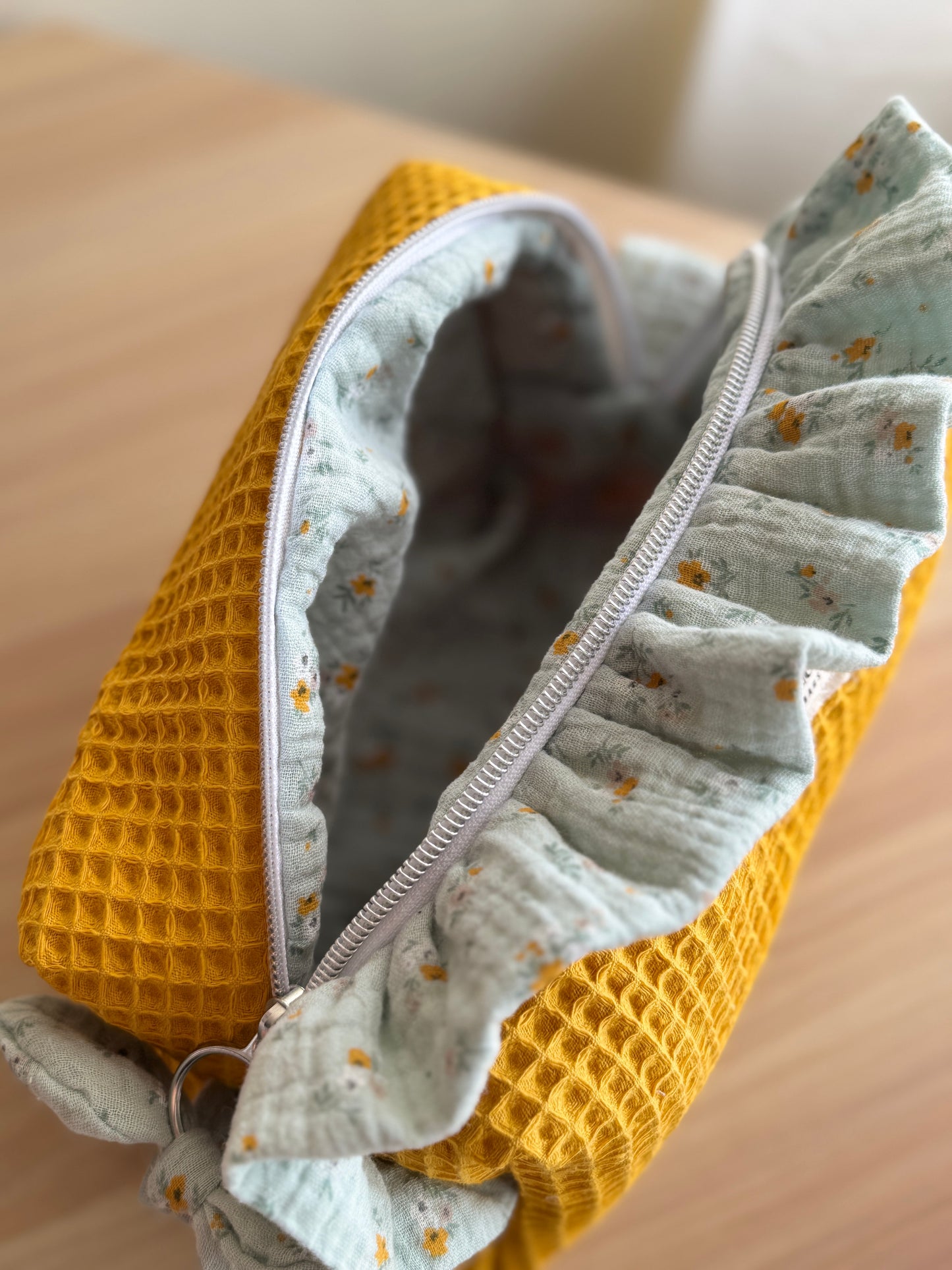 a.Cosmetic bag fresia yellow waffle and mini flowers.