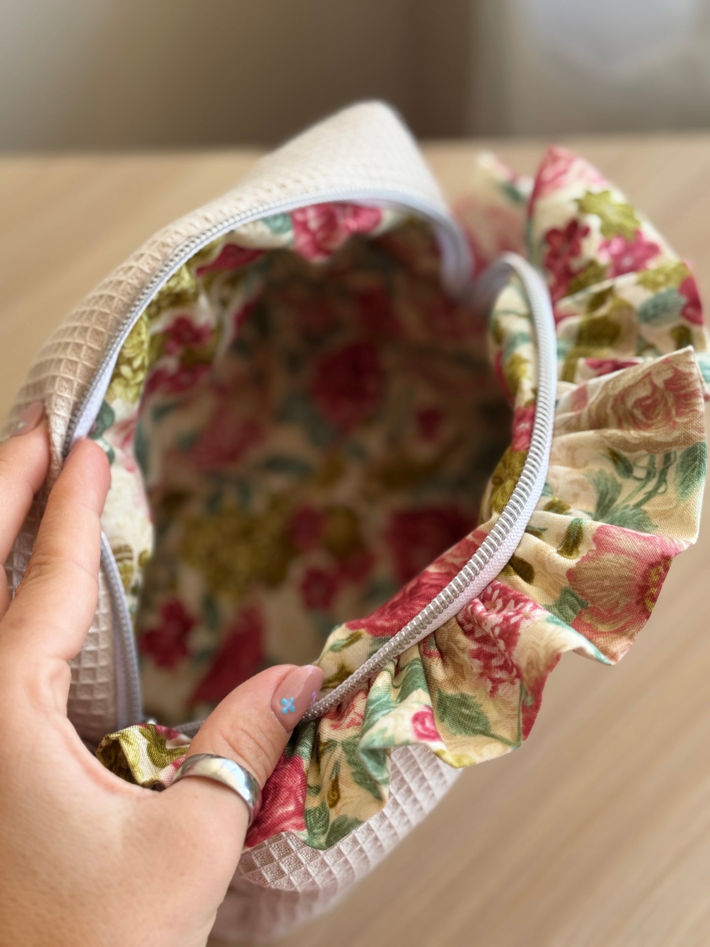 a.Cosmetic bag fresia beige waffle flowers.