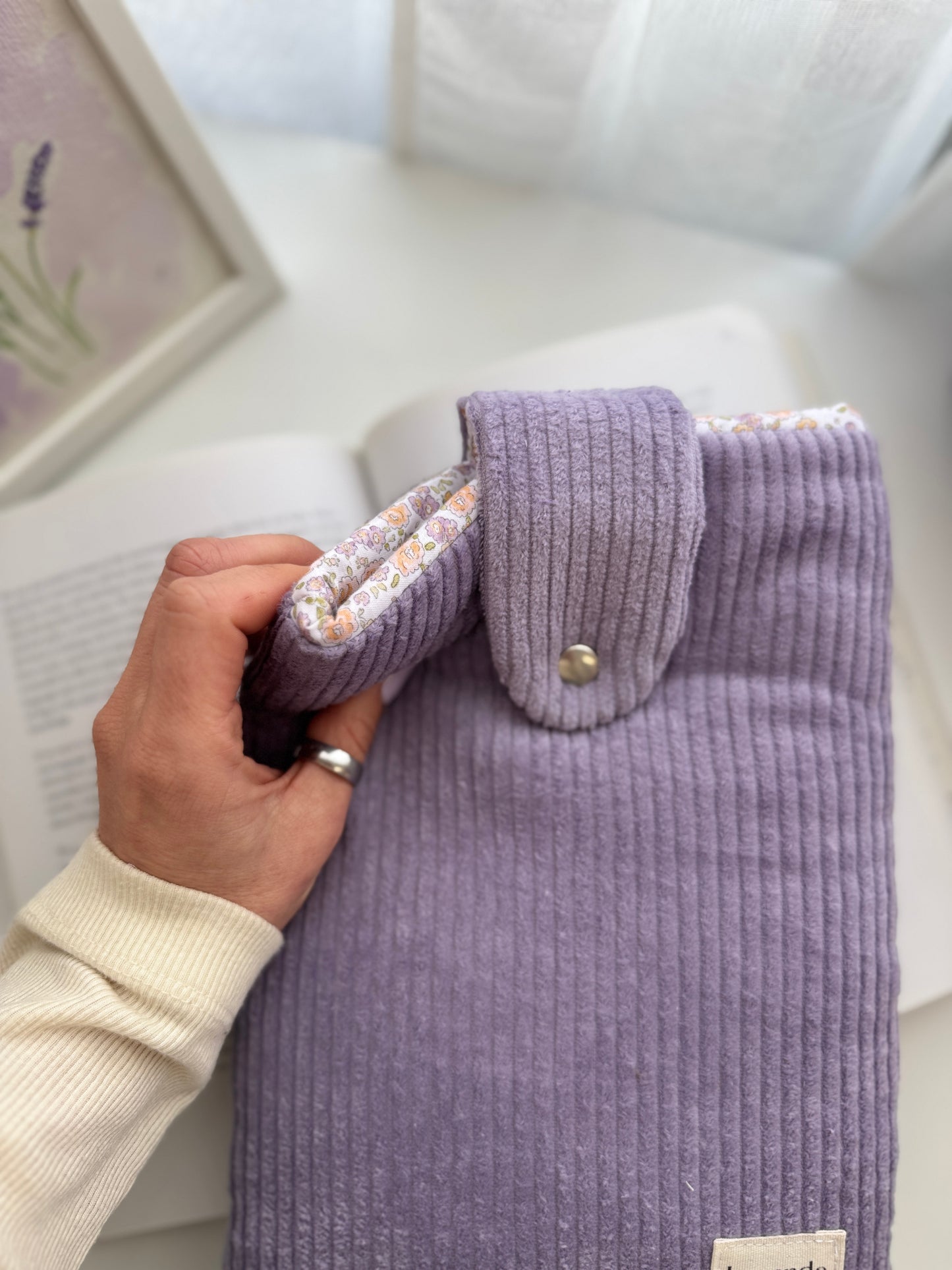 Book sleeve with button closure lilac pana.