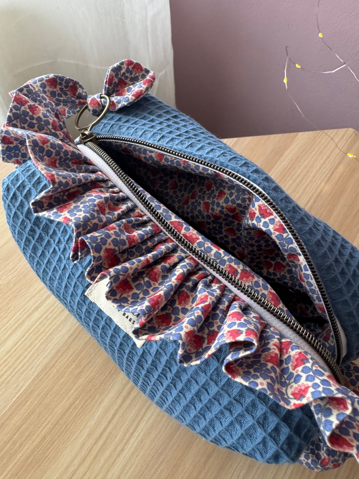 a.Cosmetic bag fresia blue waffle and mini flowers.