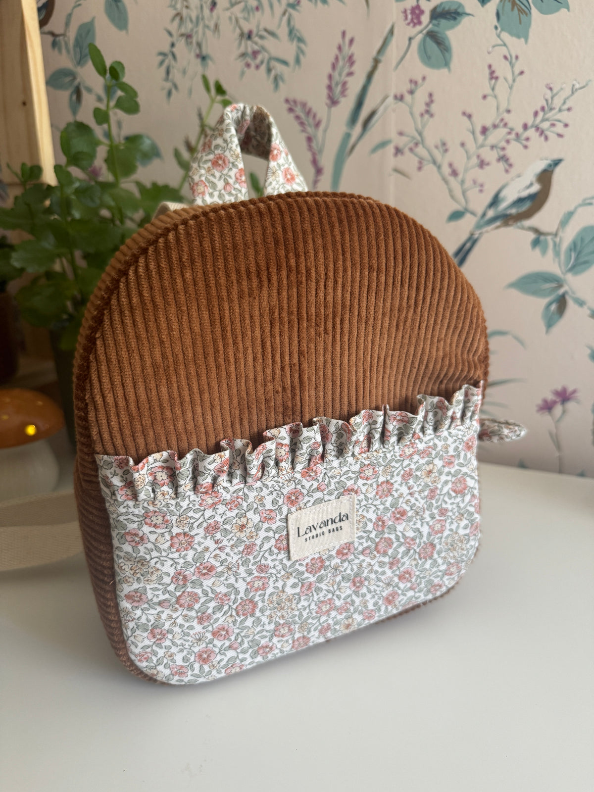 Mini backpack brawn pana and little flowers.