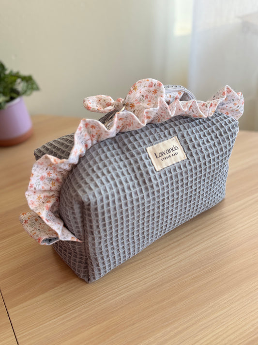 a.Cosmetic bag fresia grey blue waffle and mini flowers.